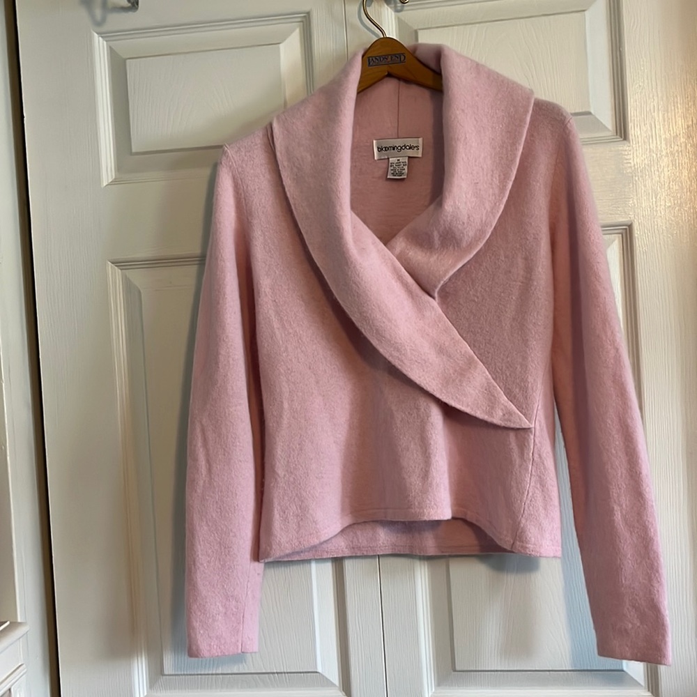 Pretty pink open neck sweater.